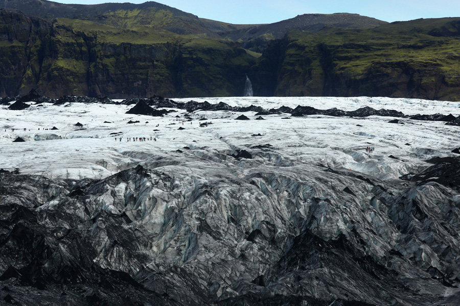 Nat Geo Expeditions, Iceland South Coast Adventure - Glacier in front of green mountain